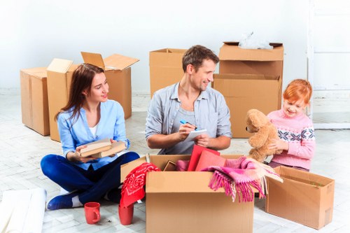 Student removals team helping with boxes and furniture in Edgware