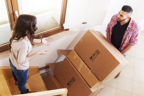 Local movers managing stair access in an Edgware property